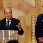 Christian politician and FPM founder Michel Aoun talks during a news conference next to Lebanon’s former prime minister Saad al-Hariri after he said he will back Aoun to become president in Beirut
