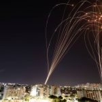 Streaks of light are seen as Israel’s Iron Dome anti-missile system intercepts rockets launched from the Gaza Strip towards Israel, as seen from Ashkelon, Israel